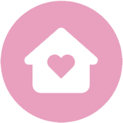 White house icon with a heart shape in the center, displayed on a pink circular background, representing senior care.
